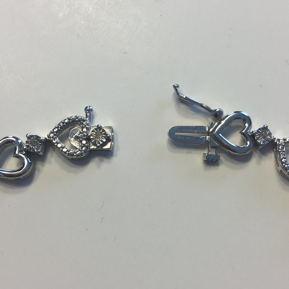 1/10 CT. T.W. White Diamond Heart Tennis Bracelet - Picture 5 of 9